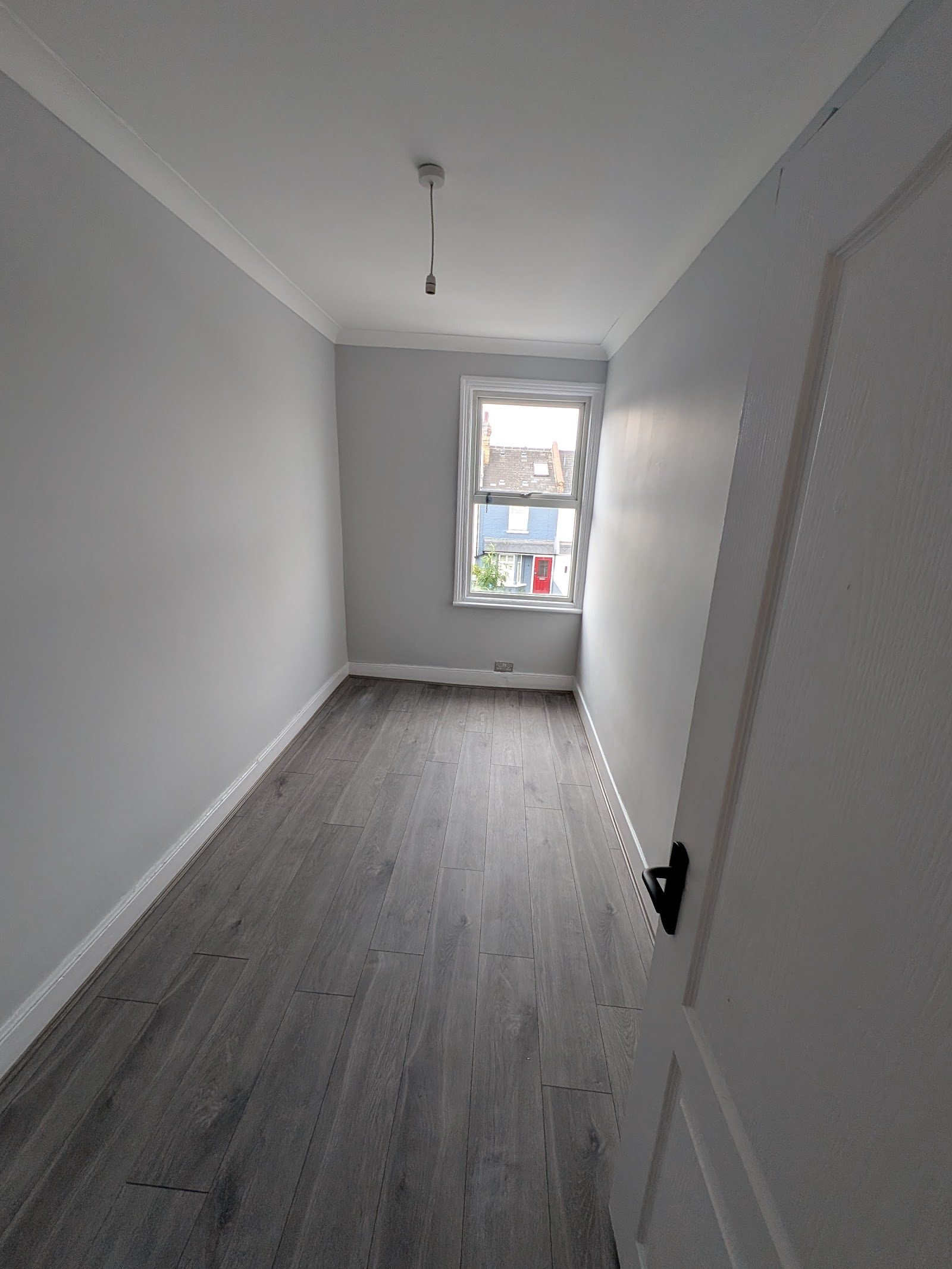 Freshly painted room with new grey flooring, Willesden NW10