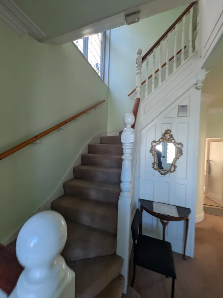 Hallway staircase with white banister before redecoration, Golders Green NW11