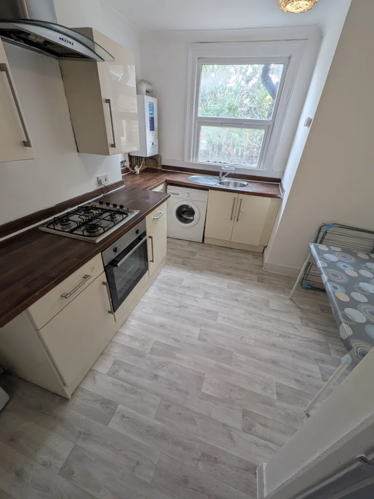 Modernised L-shaped kitchen after refit, Rucklidge Avenue NW10