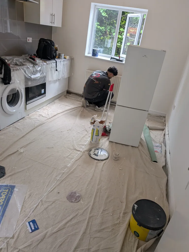 Kitchen in Tottenham N17 during fitting, with dust sheets down